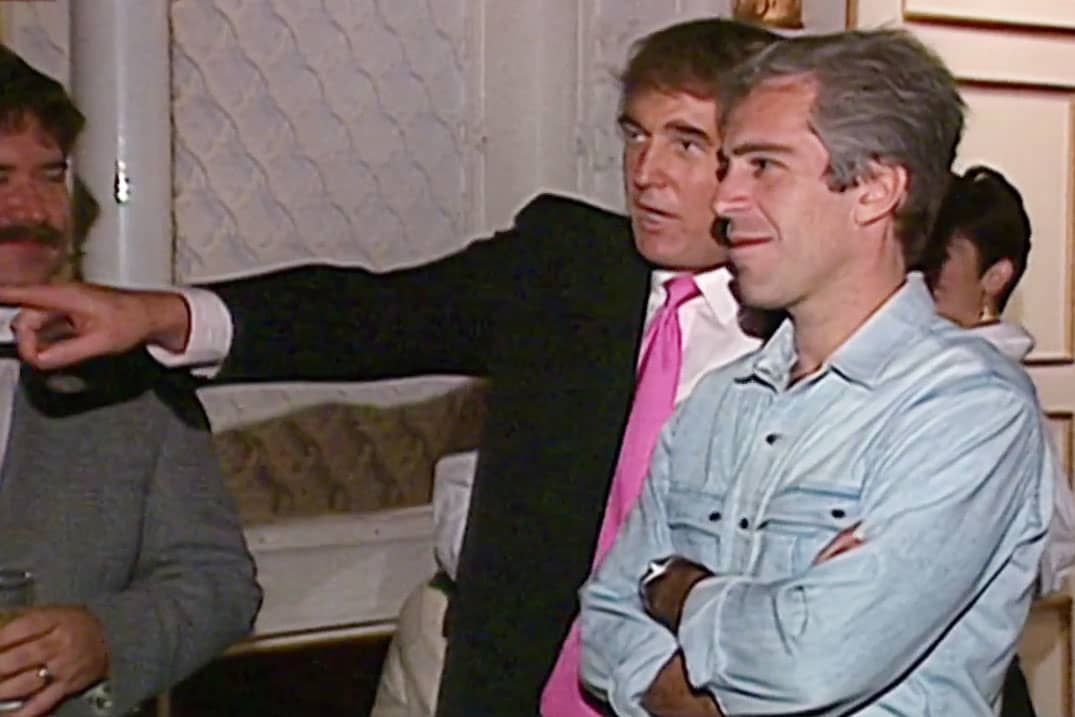 Trump pointing and Epstein looking with his arms folded
